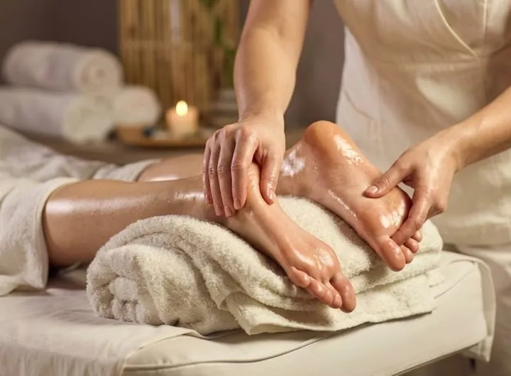 Therapist giving a relaxing foot massage